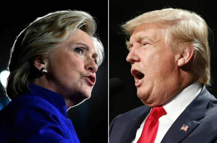 Montage de portraits d'archives d'Hillary Clinton le 2 novembre 2016à Tempe et de Donald Trump le 31 octobre 2016 à Warren 