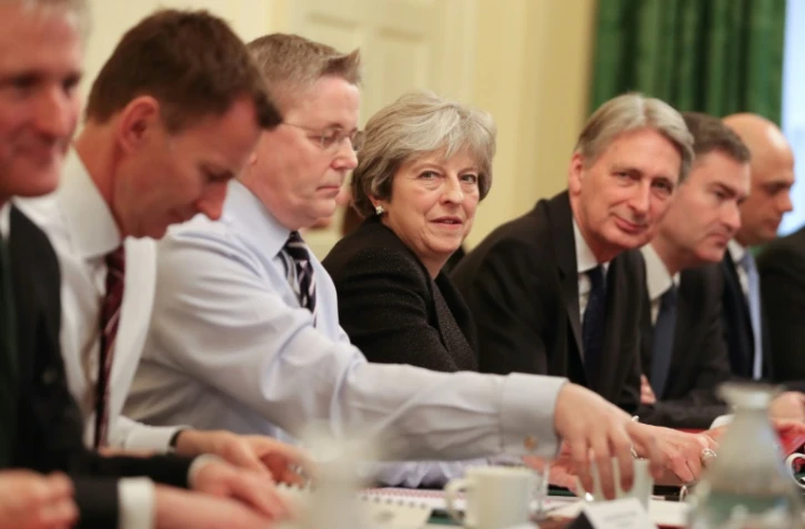 La Première ministre britannique Theresa May (C) lors de son premier conseil des ministres en 2018, à Londres, le 9 janvier