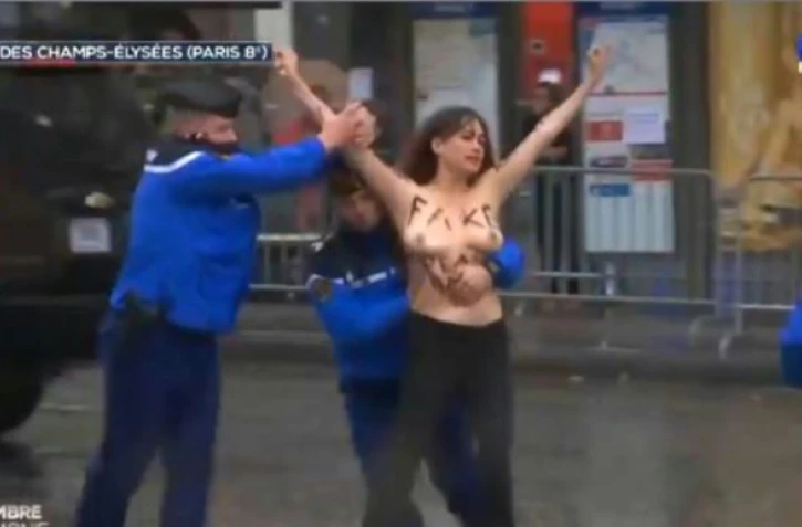 Image tirée d'une vidéo réalisée par TF1 d'une des trois Femen interpellées par des gendarmes sur les Champs-Elysées, le 11 novembre 2018