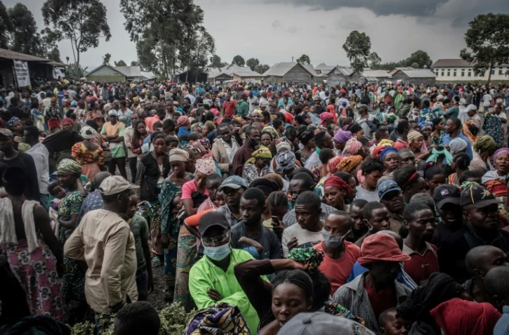 Des habitants de Goma s'enregistrent le 26 mai 2021 pour recevoir une aide alimentaire 