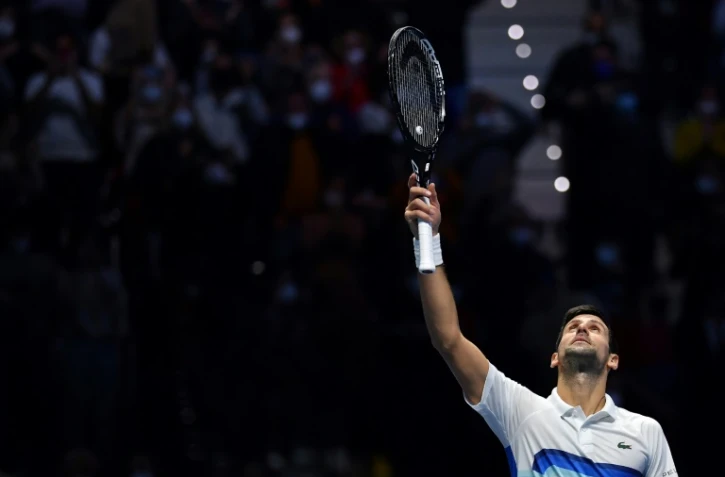 Le Serbe Novak Djokovic célèbre sa victoire sur le Britannique Cameron Norrie lors de leur match du premier tour des ATP Finals au Pala Alpitour de Turin, le 19 novembre 2021