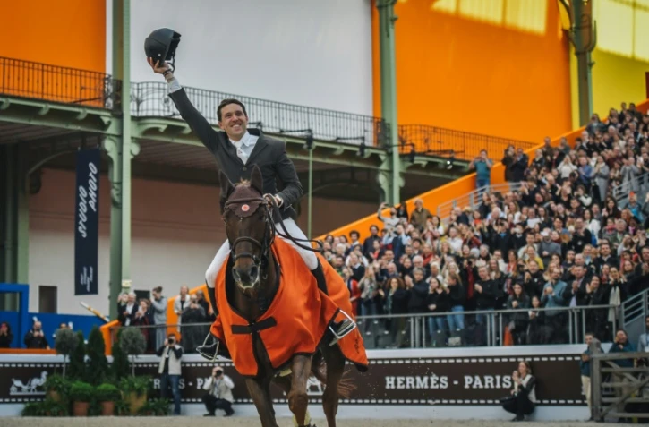 Le Français Simon Delestre sur son cheval Hermès Ryan enlève la 10e édition du Saut Hermès au Grand Palais le 24 mars 2019