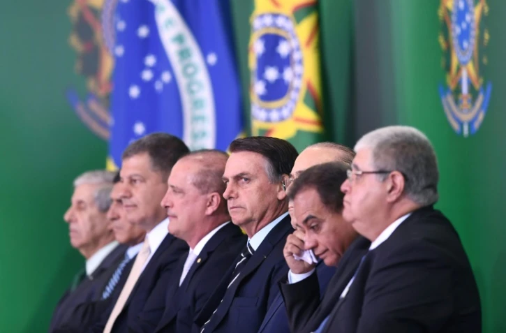 Le président jair Bolsonaro (c) à l'intronisation de ministres de son gouvernement, le 2 janvier 2019 au palais du Planalto à Brasilia