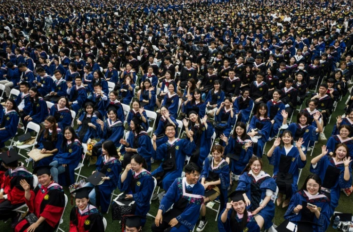 Plus de 11.000 étudiants participent le 13 juin 2021 à une remise des diplômes à Wuhan, la ville chinoise à l'épicentre de l'épidémie de Covid-19