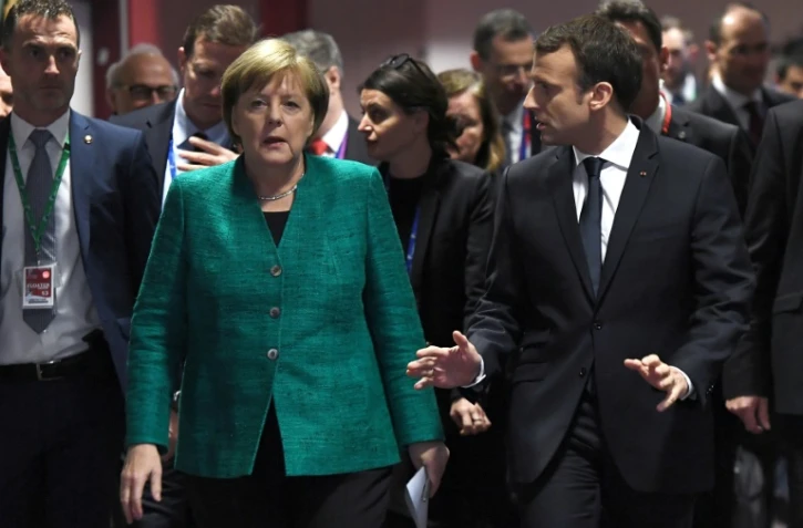 La chancelière allemande Angela Merkel et le président français Emmanuel Macro, à l'issue d'un sommet européen à Bruxelles le 15 décembre 2017