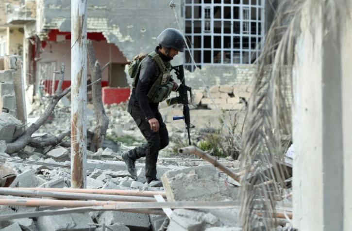 Des membres du service anti-terroriste irakien sécurisent Ramadi, le 27 décembre 2015, en Irak