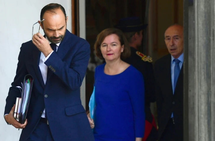 De g. à d.: le Premier ministre Edouard Philippe (L), la ministre chargée des Affaires européennes Nathalie Loiseau et le ministre de l'Intérieur Gérard Collomb, le 12 juillet 2017 au palais de l'Elysée à Paris