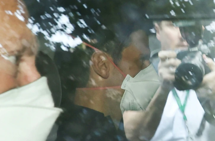 Novak Djokovic arrive au bureau de ses avocats à Melbourne pour suivre la retransmission en direct de l'audience sur son cas devant la Cour fédérale d'Australie, le 16 janvier 2021