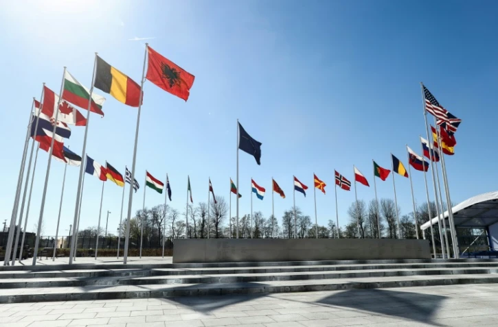 Les drapeaux des pays membres de l'Otan flottent au siège de l'Alliance à Bruxelles le 3 avril 2023