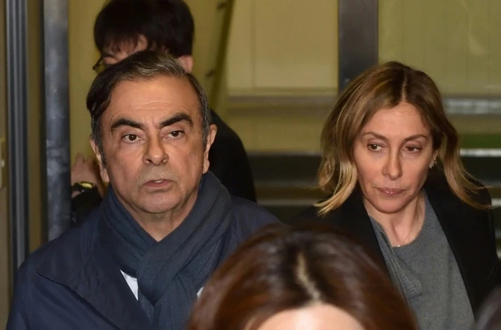 Carlos Ghosn (g) et sa femme Carole Ghosn à Tokyo le 3 avril 2019
