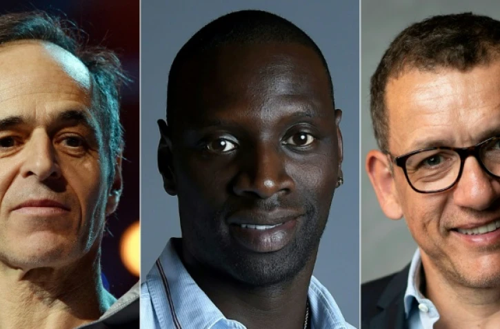 Montage de photos d'archives réalisé le 30 décembre 2018 montrant (de G à D) le chanteur Jean-Jacques Goldman (15 janvier 2014), l'acteur Omar Sy (18 avril 2016) et l'acteur et réalisateur Dany Boon (24 avril 2018)