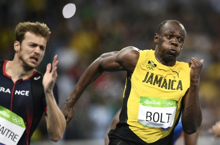 Le Jamaïcain Usain Bolt vainqueur du 200 m et le Français Christophe Lemaitre, 3e, lors des JO de Rio le 18 août 2016