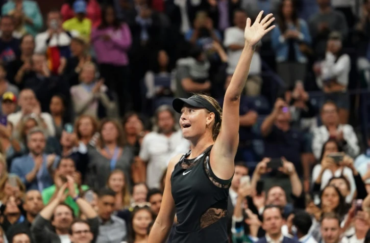 Maria Sharapova fête sa victoire sur Simona Halep à l'US Open à New York, le 28 août 2017