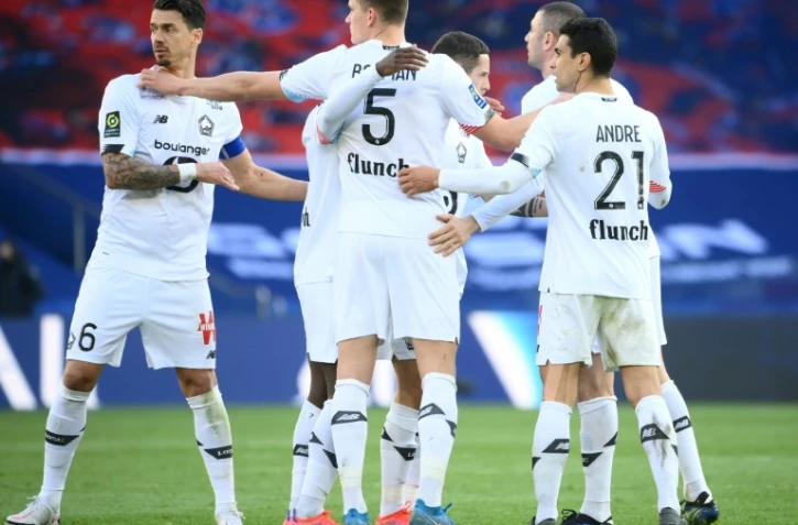 La joie des joueurs lillois après leur victoire, 1-0 face au Paris Saint-Germain, lors du match de L1, le 3 avril 2021 au Parc des Princes
