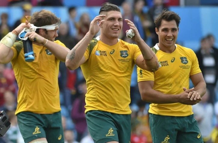 Ben McCalman de l'équipe d'Australie(à gauche), Sean McMahon et Nick Phipps (à droite) après la victoire contre l'Uruguay lors de la coupe du monde de rugby le 26 septembre 2015 à Birmingham