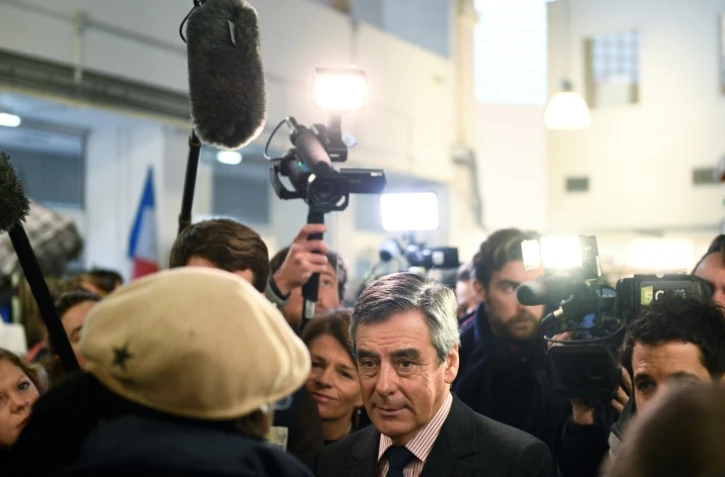 François Fillon lors d'une visite dans un centre Emmaüs du 19e arrondissement, le 3 janvier 2017 à Paris
