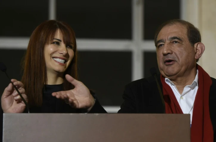 L'ancien vice-Premier ministre syrien Qadri Jamil (D) parle à la presse, avec à ses côtés Randa Kassis, opposante laïque et co-présidente de la délégation d'opposants syriens proches de Moscou, au siège de l'Onu à Genève, le 16 mars 2016