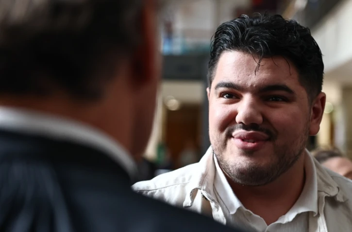 Amine Kessaci arrive au palais de justice d'Aix-en-Provence le 19 octobre 2026 pour le procès d'un triple narchomicide