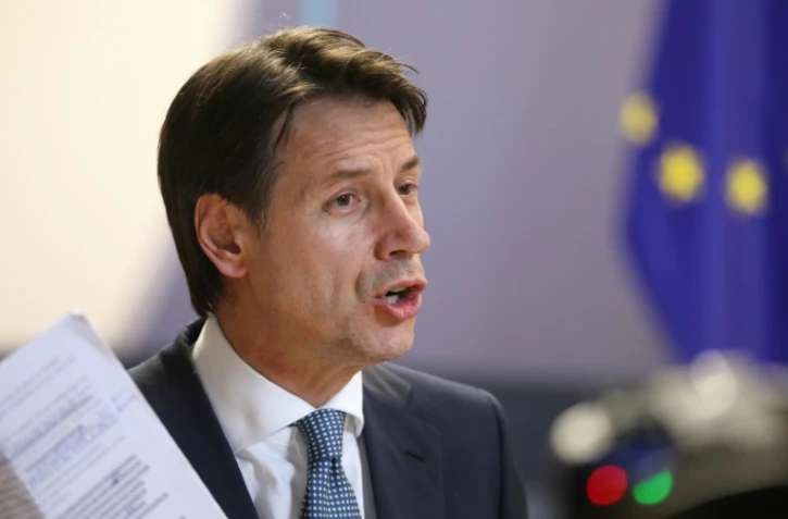 Le Premier ministre italien Giuseppe Conte parle à la presse après l'accord trouvé sur les migrations à Bruxelles, le 29 juin 2018