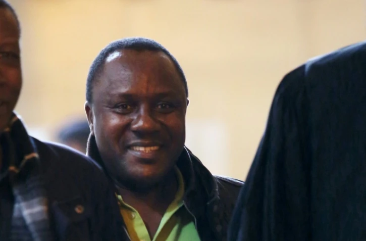 Claude Muhayimana (C), le 11 octobre 2013 à Paris