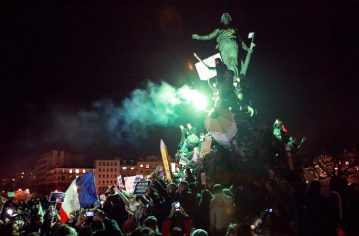 Des personnes prennent part à la "Marche Républicaine" le 11 janvier 2015, place de la Nation à Paris

