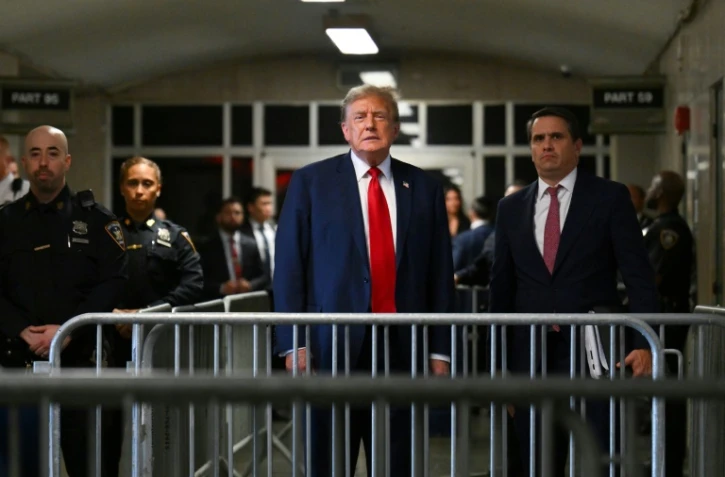 Donald Trump à la sortie de la salle d'audience au terme du premier jour de son procès pénal à New York, le 15 avril 2024