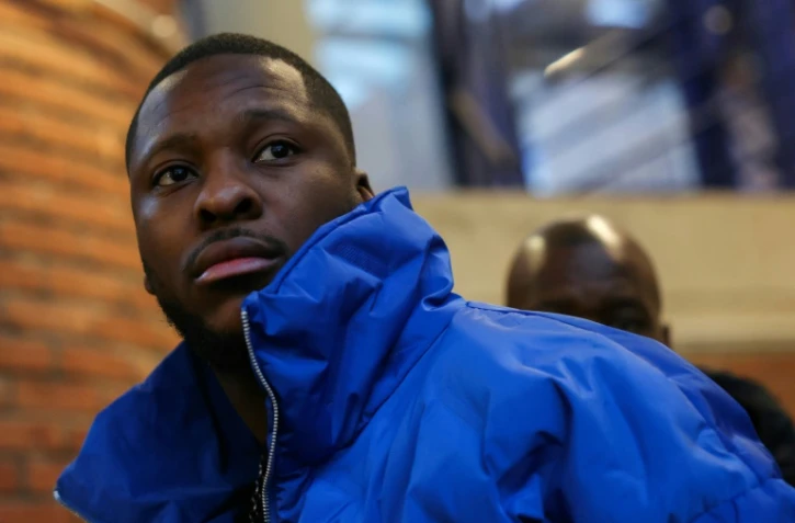 Théo Luhaka arrive à l'ouverture du procès des trois gardiens de la paix, le 9 janvier 2024 à Bobigny