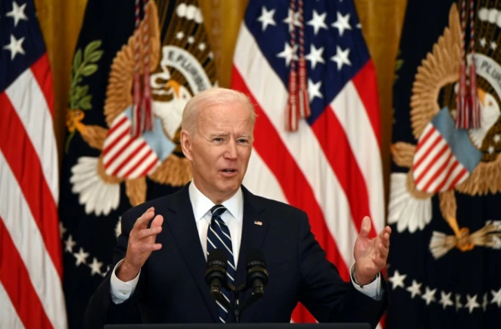 Le président américain Joe Biden répond à des questions après la première conférence de presse de son mandat, le 25 mars 2021 à Washington