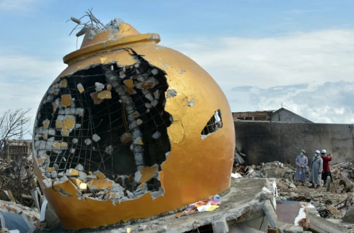 Des recherches se poursuivent après un séisme suivi d'un tsunami meurtriers dans la zone de Balaroa près de Palu en Indonésie, le 8 octobre 2018