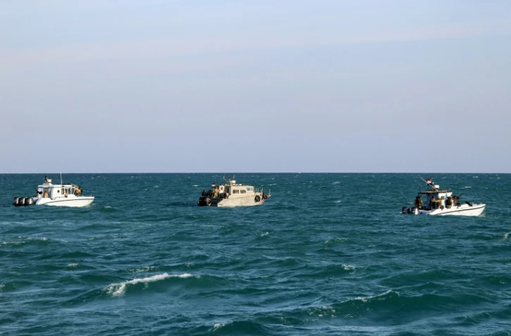 Des bateaux des garde-côtes yéménites, fidèles au gouvernement internationalement reconnu, en patrouille dans la mer Rouge, près du détroit stratégique de Bab al-Mandab, le 12 décembre 2023


