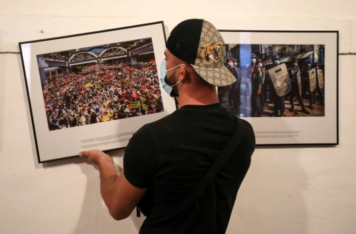 Des photos de l'exposition "Photographe anonyme en Birmanie" réalisée pour le New York Times, en amont du Festival international de photojournalisme Visa pour l'Image, à Perpignan, le 25 août 2021