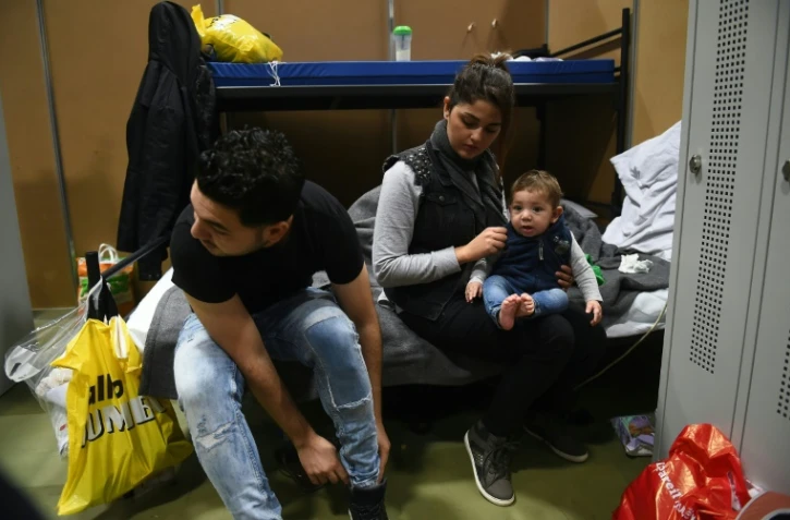 Ahmed, Alia et Adam dans un camp de réfugiés à Leeuwarden, aux Pays-Bas, en décembre 2015