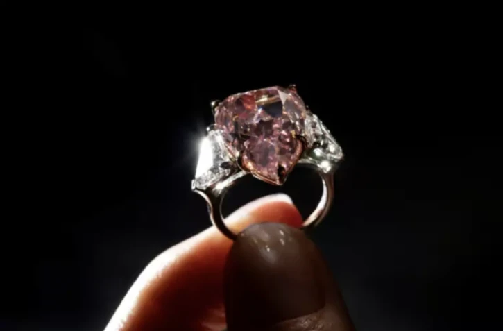 The gem is the largest pear-shaped pink diamond of its quality ever sold at auction ( AFP / Fabrice COFFRINI )