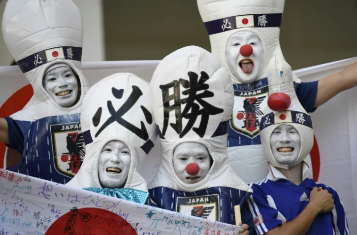 Des supporters japonais avant le match contre la Pologne lors du Mondial